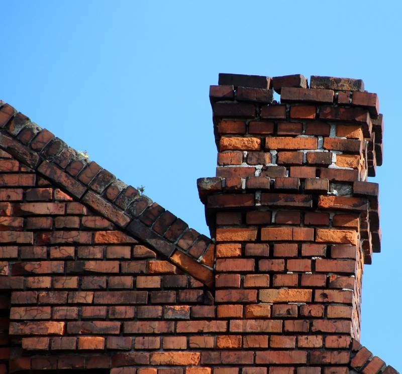 Signs Your River Forest Home Needs a Chimney Inspection Damaged chimney on an River Forest home showing cracks and missing mortar